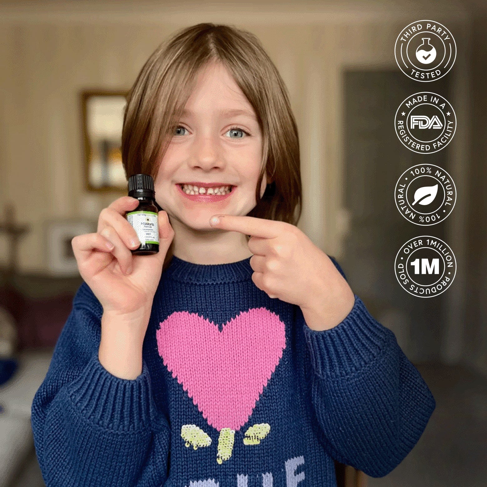Smiling child holding H-Warts Formula natural wart removal product,.Highlights third-party tested, 100% natural, over 1 million sold; effective for common, plantar, flat, facial, body, and nail warts.